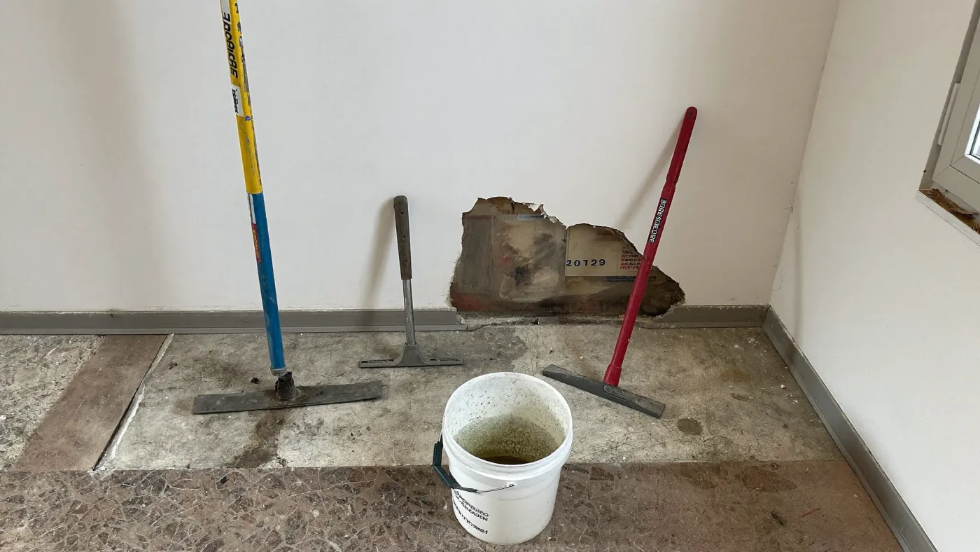 A wall surface with damp stains and salt efflorescence